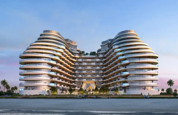 Modern curved building by the waterfront.