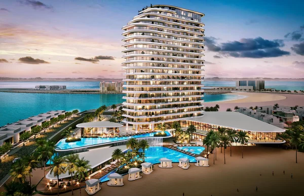 Modern hotel by the beach at sunset.